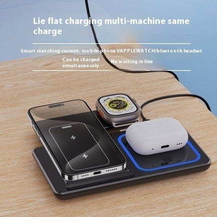 3-in-1 foldable wireless charging station in black, charging phone, watch, and AirPods on desk