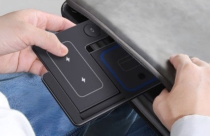 Foldable 3-in-1 wireless charging station being stored in a travel bag