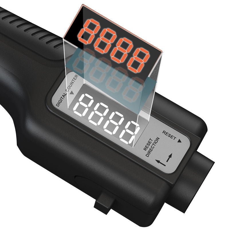 Close-up of digital counter display on adjustable hand grip strengthener, showing reset button and direction control.