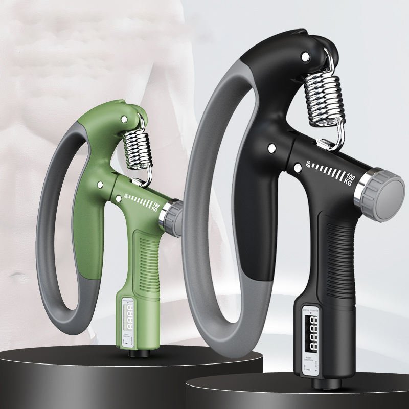 Close-up of two adjustable hand grip strengtheners with digital counters on display stands, showing green and black variants.