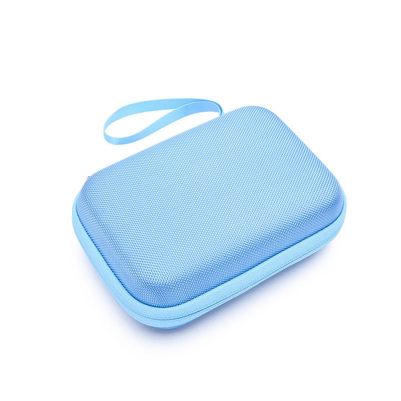 Blue zippered travel case for baby grooming kit with wrist strap on white background