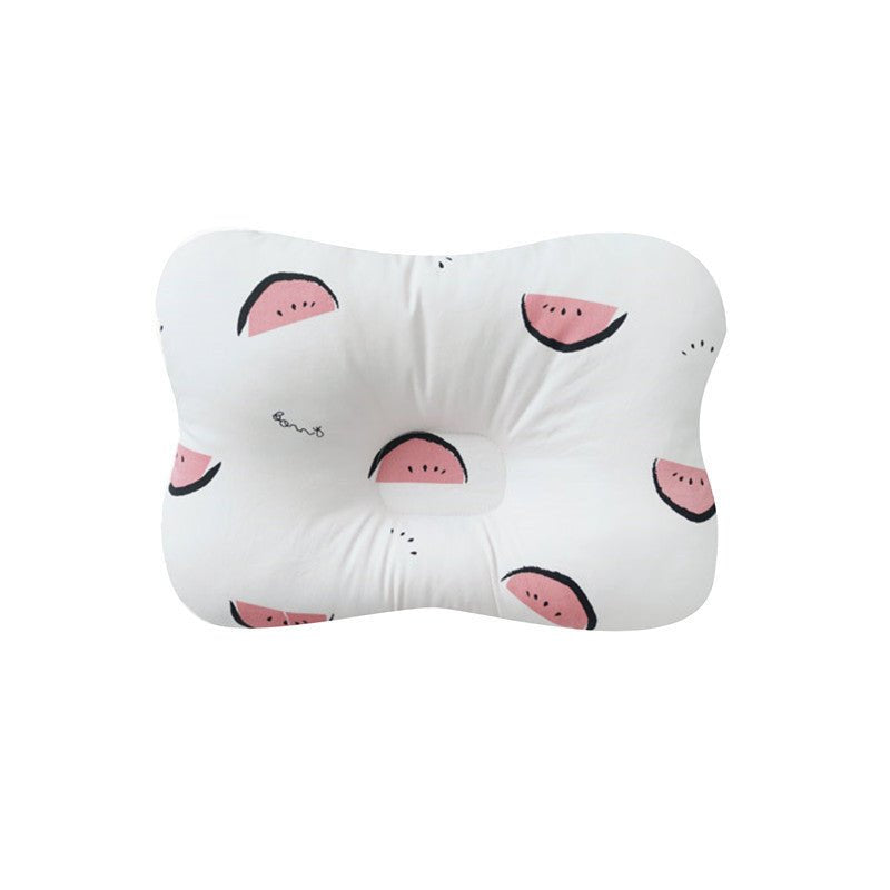 White pillow with pink watermelon slices on a white background