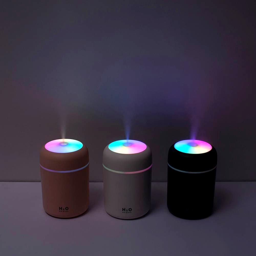 Three Color Cup USB Air Humidifiers in the dark with colorful LED lights and mist
