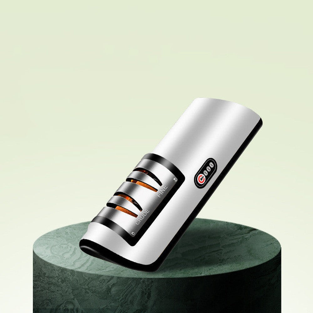 Black variant of the electric knife and scissor sharpener displayed on a modern pedestal with dual-slot design.