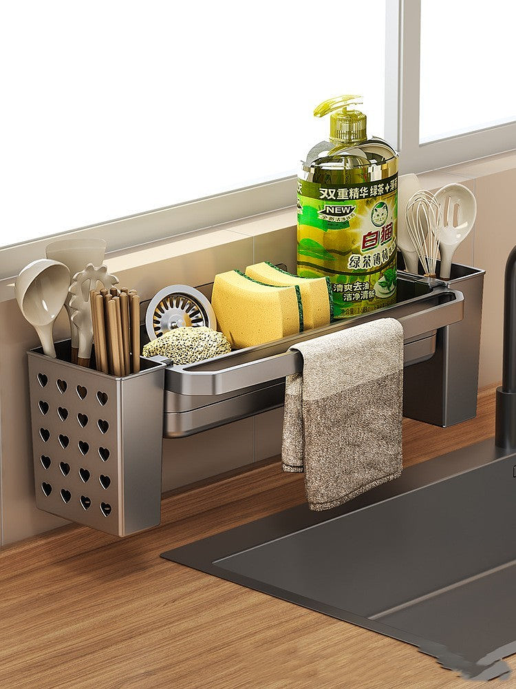 Over-sink kitchen storage rack with heart-shaped utensil holder and cleaning supplies on a wooden countertop