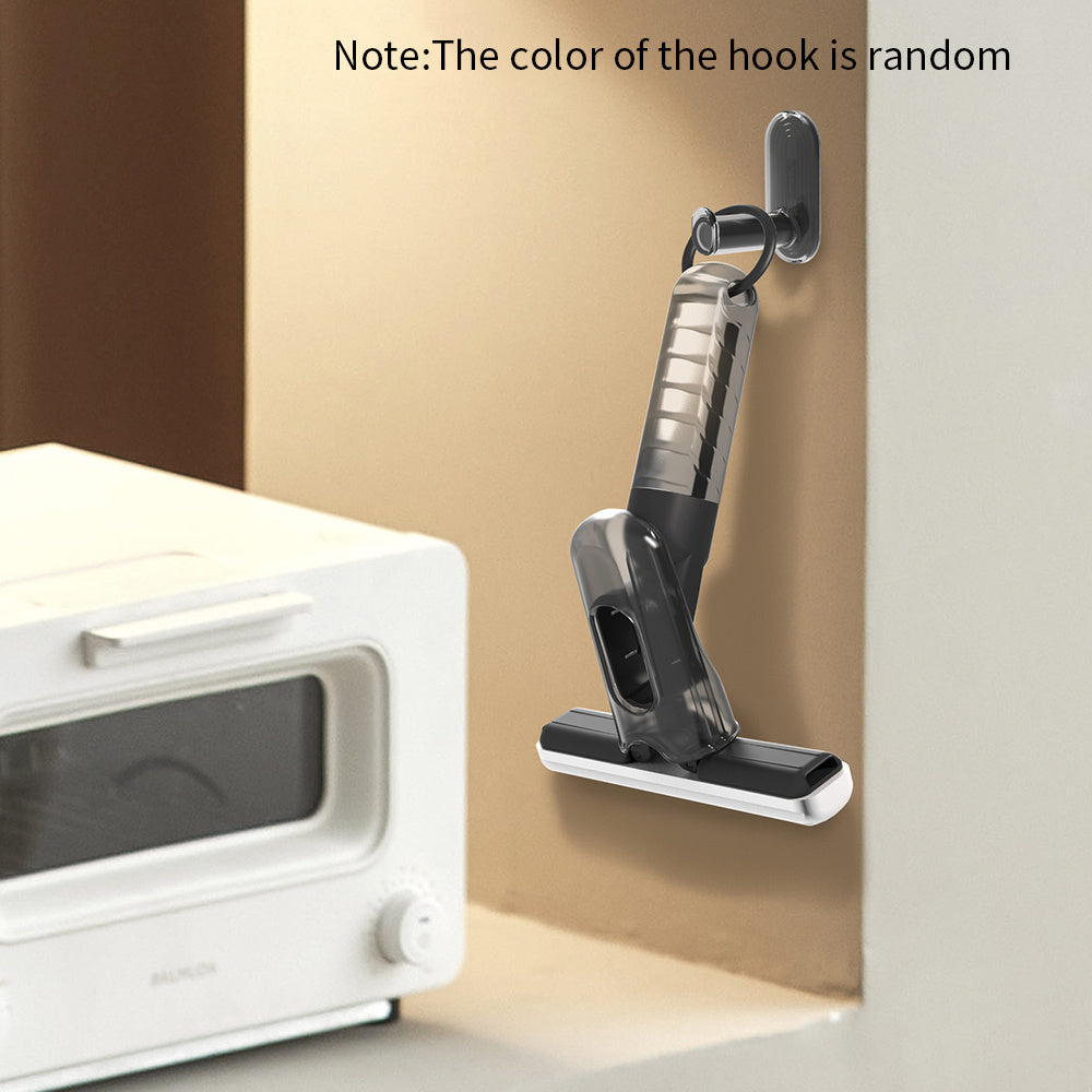 Compact mini spray mop hanging on wall hook for easy storage in small kitchen space
