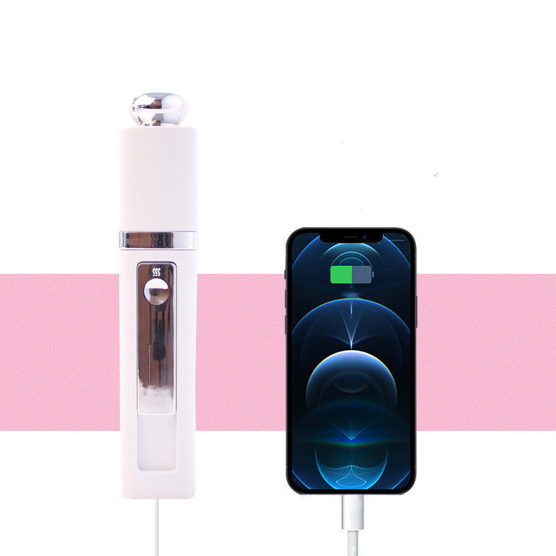 White nano facial mister connected to a smartphone, showing power bank charging function