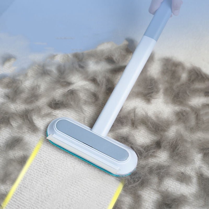 Pet hair removal brush used on carpet surface for deep cleaning