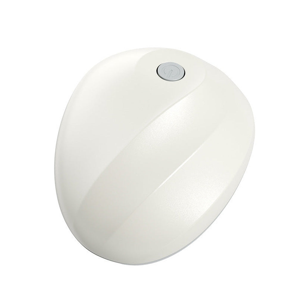 Top view of rechargeable intelligent scalp massager with a single power button