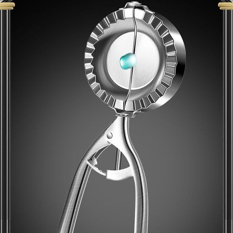 Front view of stainless steel dumpling maker showing symmetrical sealing edges