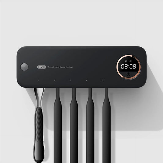 Wall-mounted black smart toothbrush holder with digital display and UVC sterilization feature, holding five toothbrushes in a modern minimalist bathroom setup.