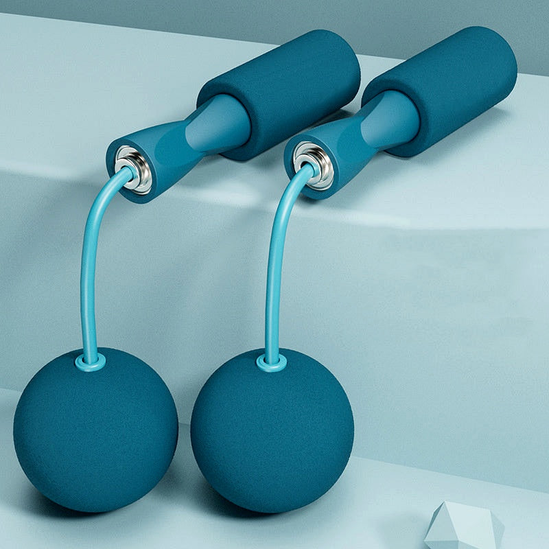 Blue adjustable jump rope set with weighted balls and foam handles, placed on a minimal background.