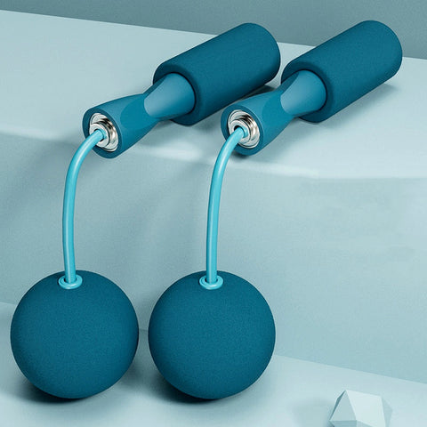 Blue adjustable jump rope set with weighted balls and foam handles, placed on a minimal background.