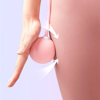 Close-up of a pink weighted jump rope ball in use during a workout, shown near the hip for demonstration.