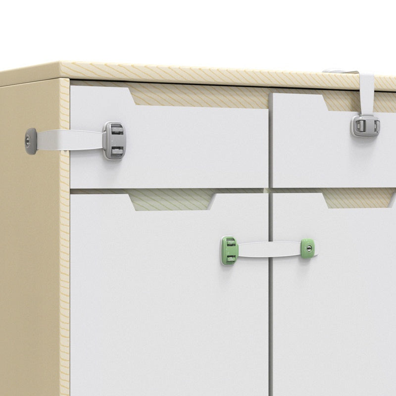 Child safety straps securing various drawers and cabinet doors in a modern home setting.