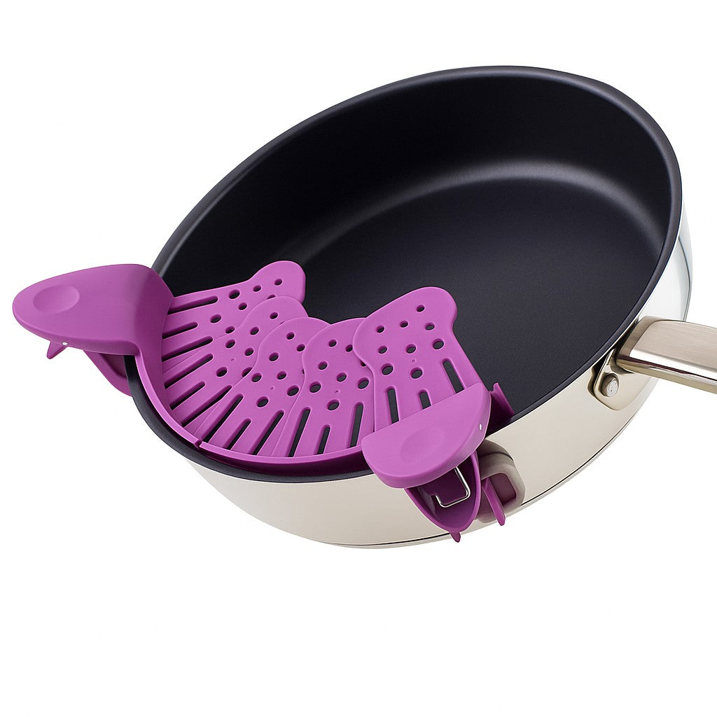 Purple clip-on strainer securely attached to a non-stick frying pan, shown on a clean white background.
