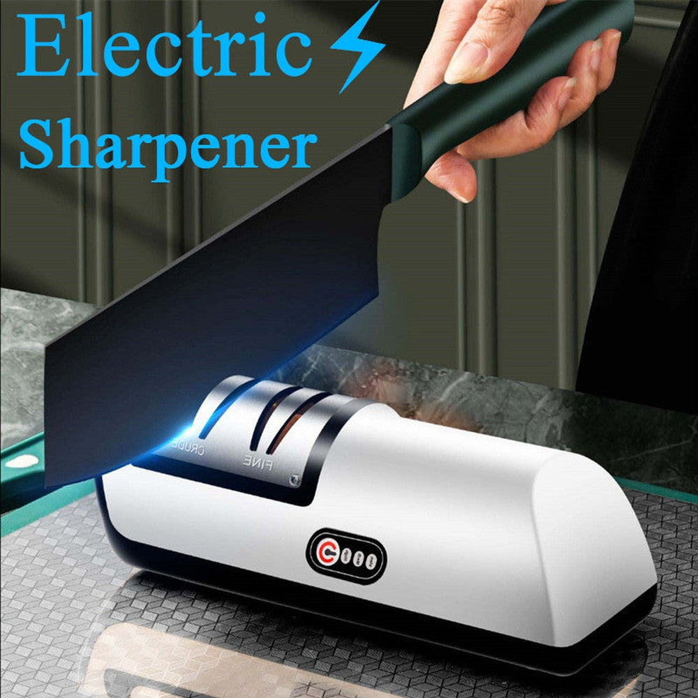 Electric knife and scissor sharpener in use, sharpening a chef’s knife with a dual-slot design.
