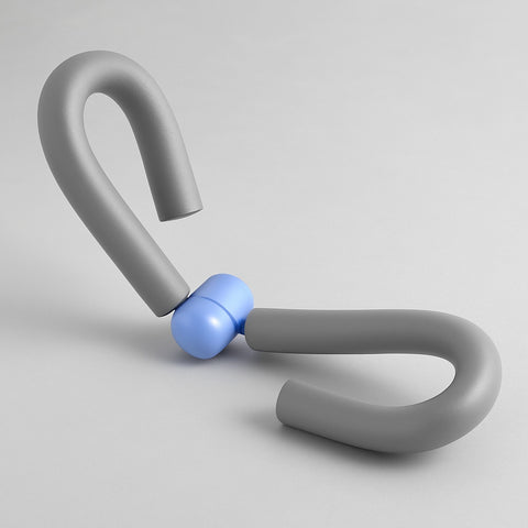 Gray leg and thigh workout trainer with pastel blue hinge resting on a neutral gray background