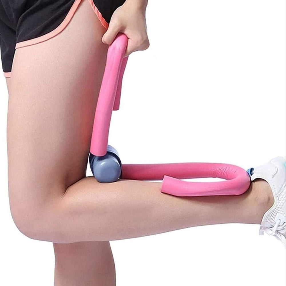 Leg and thigh workout trainer in use, shown squeezing between a person's thigh and calf during exercise