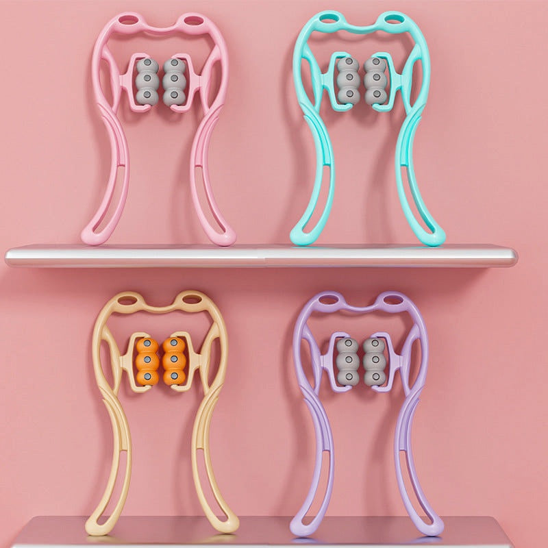 Four color variants of the magnetic neck massager displayed on pink shelves: pink, turquoise, beige, and purple