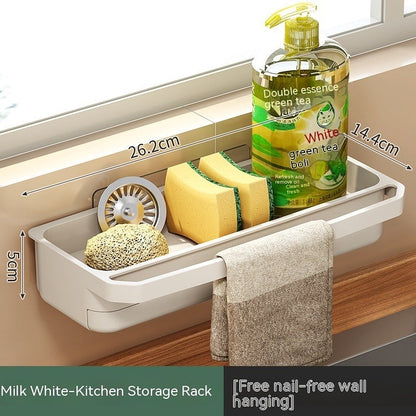 Milk white kitchen storage rack with dimensions labeled, holding sponges, dish soap, and towel above a wooden countertop