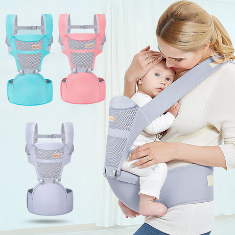 Mother holding baby in grey multifunctional baby carrier with waist stool – also available in pink and blue