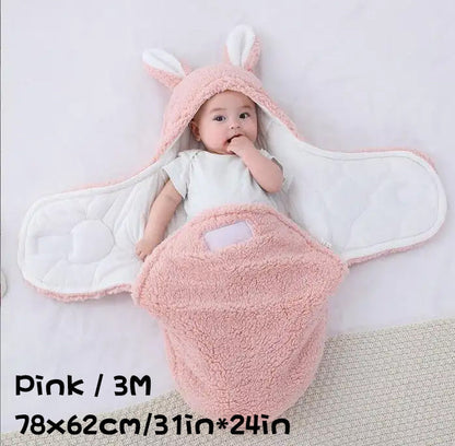 Baby in a pink fluffy swaddle sleeping bag with bunny ears, labeled "Pink / 3M 78×62cm/31in*24in".