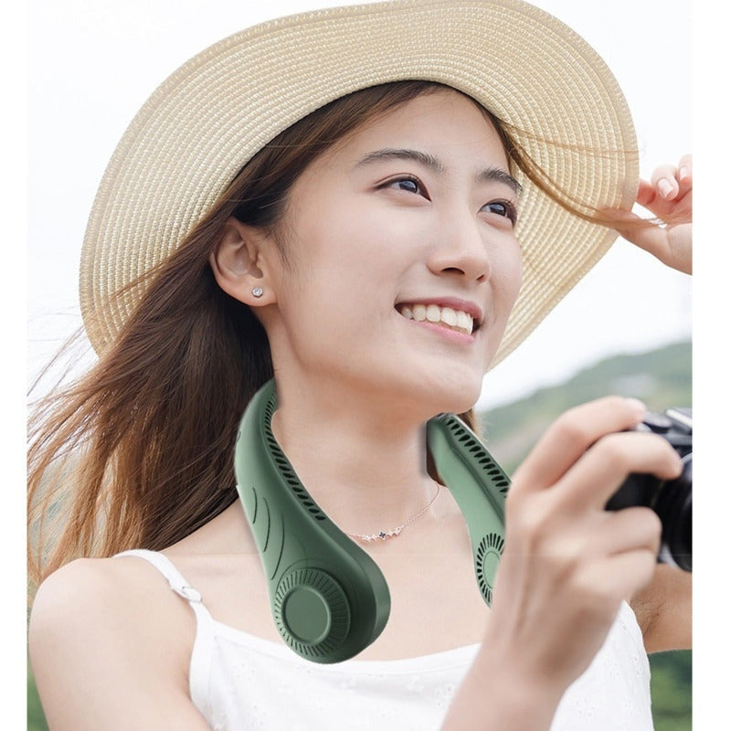 Woman wearing a green bladeless neck fan outdoors for hands-free cooling on a warm day.