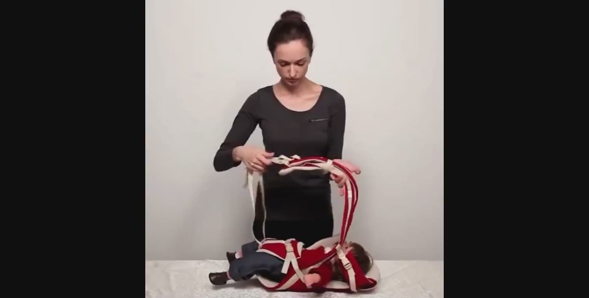 Parent demonstrating the Four Seasons Baby Carrier in different carrying positions for newborns and toddlers