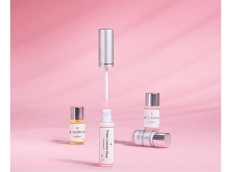 Professional Lash Lift Kit – Eyelash Glue and Nourishing Lotion Bottles on Pink Background