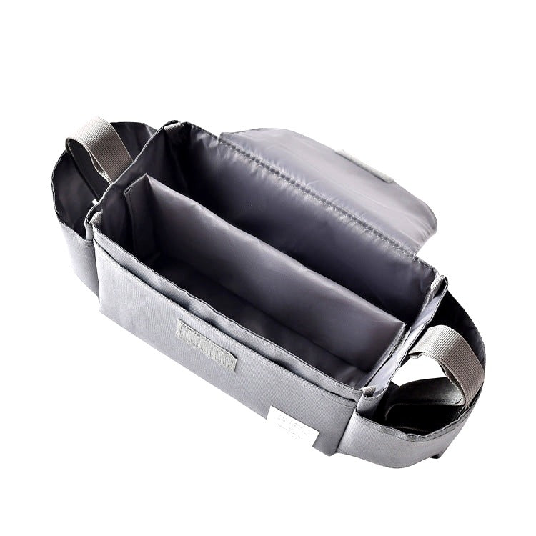 Open gray stroller organizer showing spacious interior with multiple compartments and side handles, photographed on a white background.