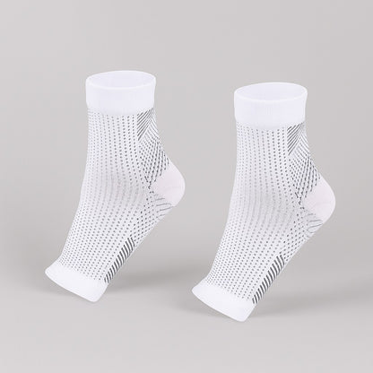 Pair of white ankle-length compression sleeves with black woven patterns, displayed on a neutral background