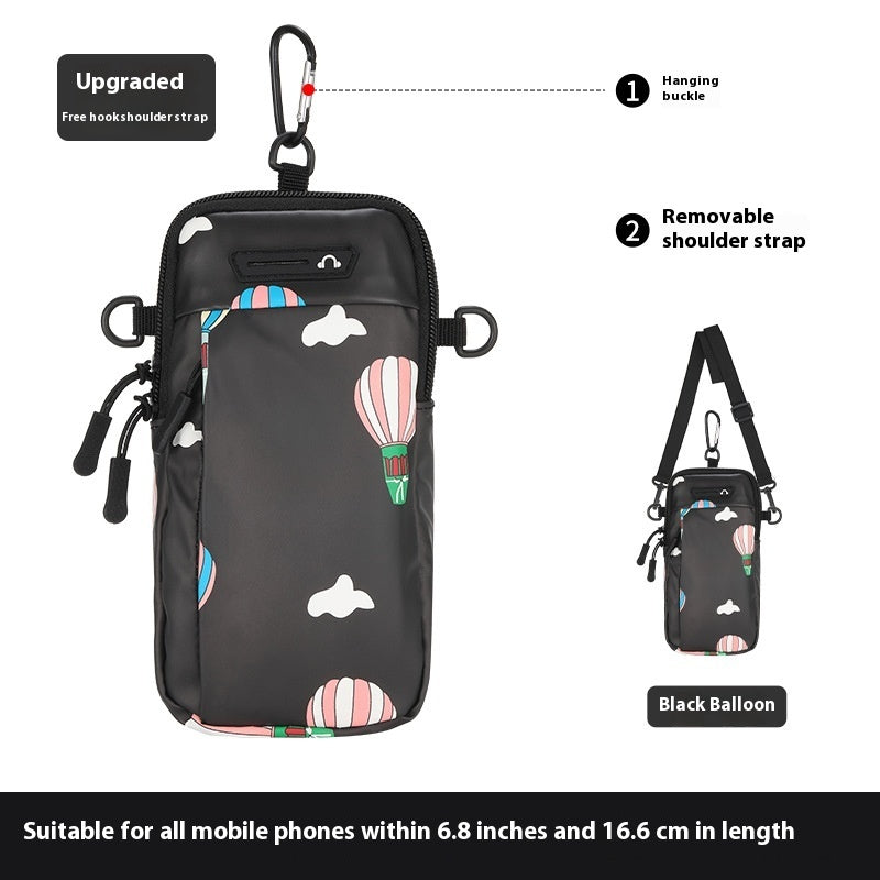 Black phone case with hot air balloon design, featuring a hanging bubble and removable shoulder strap.